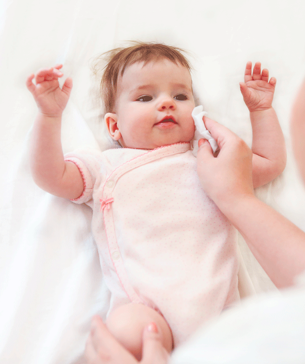 If your baby is showing symptoms of heat exhaustion, cool them down with a damp cloth.