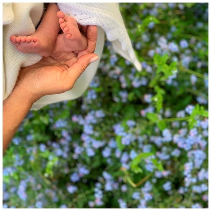 To celebrate Mother's Day in the US, Sussex Royal shared a photo of Meghan lovingly cradling her son's tiny feet against a backdrop of forget-me-not flowers- Princess Diana's favourite bloom.