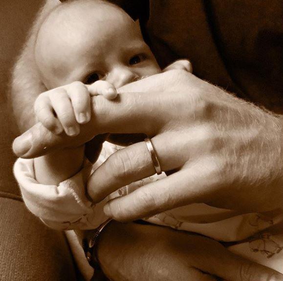 For Father's Day, the Duke and Duchess of Sussex shared a similar candid photo of little Archie holding on to his dad's finger. Too cute!