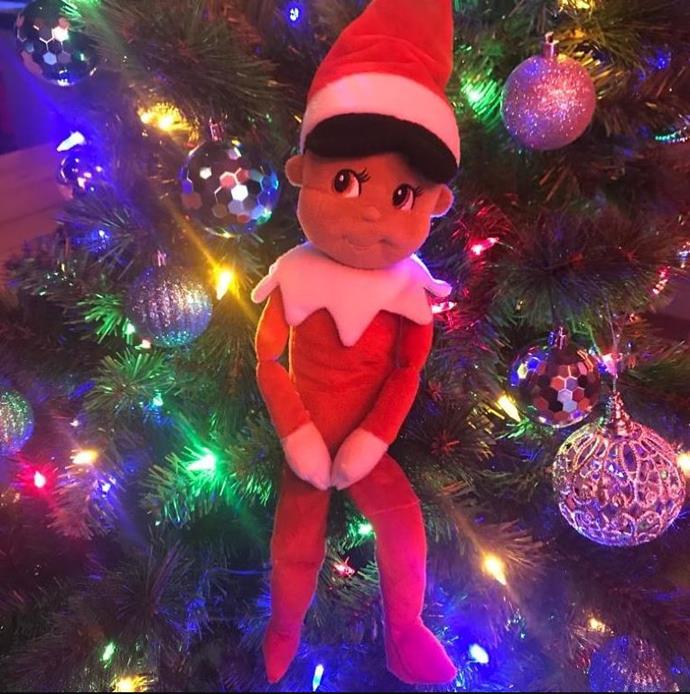The elf on the shelf is up in Dannii Minogue's house. Well, in the tree technically!