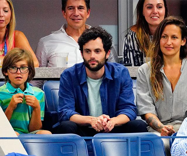 Domino's son Cassius, sitting with Penn and Domino at the US Open in 2019.