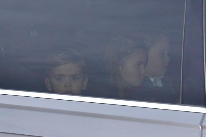 All three Cambridge children rode in the back seat on their way home.