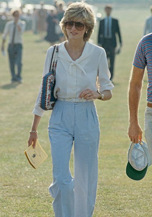 On a sunny day in 1983, the Princess of Wales made all our fashion dreams come true at once - we are obsessed with this glorious high-waisted wide-legged white shirt extravaganza.