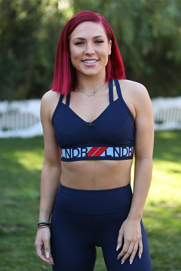 Sharna Burgess is back as a judge on *Dancing With The Stars* for a second season. 