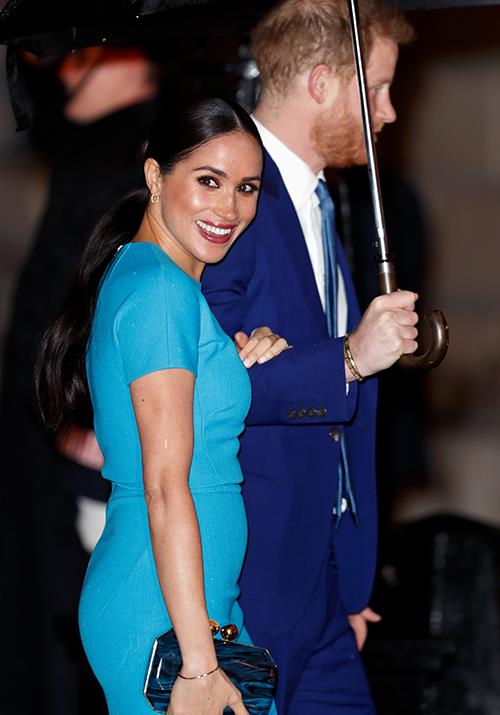 The Duchess oped for a bright blue Victoria Beckham midi dress for the occasion.