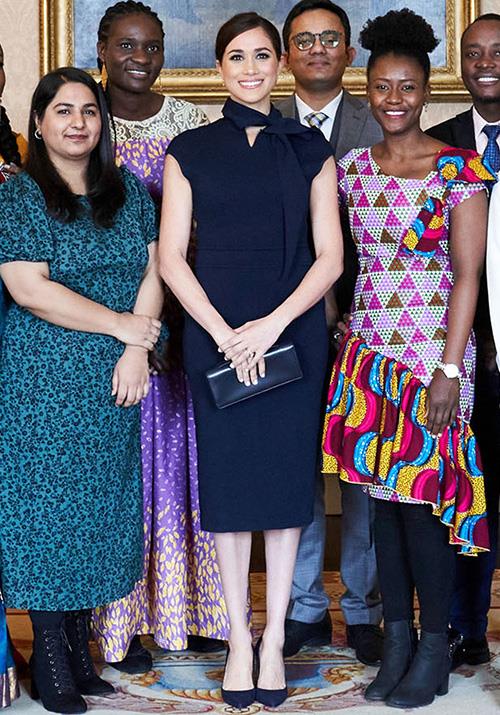 For her final engagement as a working senior royal, Meghan wore a [beautiful navy midi dress](https://www.nowtolove.com.au/royals/british-royal-family/meghan-markle-scanlan-theodore-dress-63015|target="_blank") by Australain label Scanlan Theodore. The Melbourne-based brand's chic short sleeve silhouette and regal hue was the best way to end with a bang - in our not-so-biased opinion!