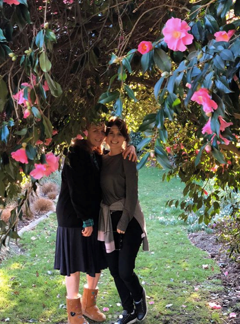 Eugenie and her mum are seen under a floral-clad tree in one of the beautiful images.