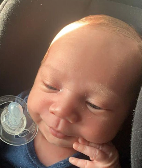 Too cute! That peek of lighter toned hair makes us think Boston is going to look *just* like his dad before long.