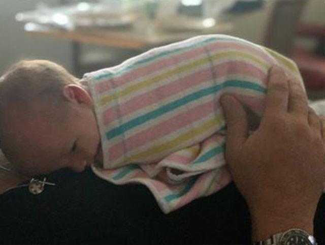 Karl shared this touching photo with his newborn daughter, Harper May Stefanovic.