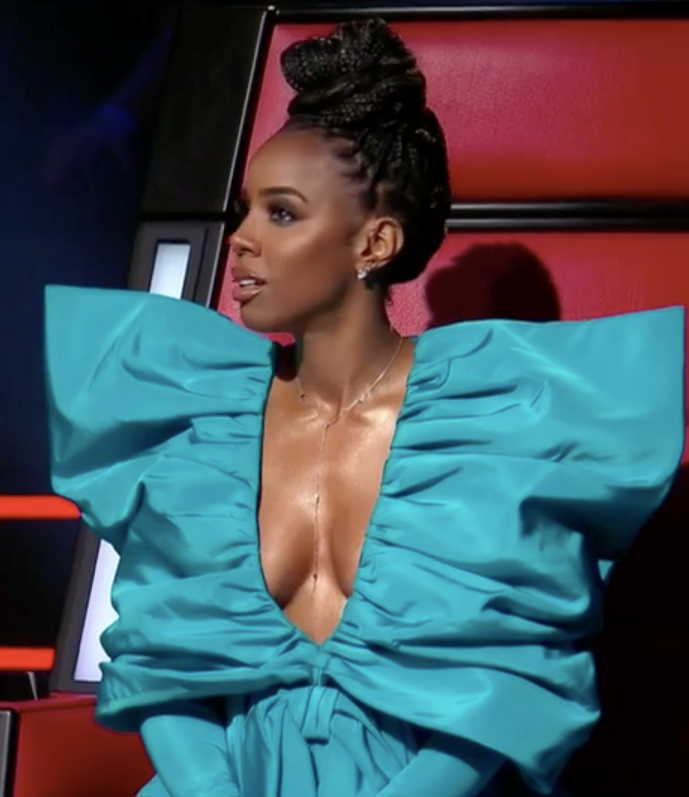 Our other favourite coach, Kelly Rowland went big and bold for the premiere, wearing this unique turquoise dress featuring a plunging neckline and shoulders that made fans stop in their tracks - for obvious reasons.
