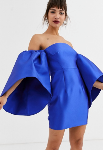 Go big or go home by channeling Kelly in this ASOS edition flared sleeve mini dress. $190, [buy it online here](https://www.asos.com/au/asos-edition/asos-edition-structured-mini-dress-with-extreme-sleeve/prd/13199241|target="_blank"|rel="nofollow"). 