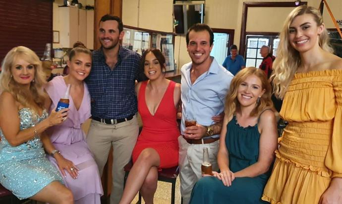 Sophie (centre, in red) pictured onset with Farmer Alex (left) and Farmer Sam (right), along with some of her fellow contestants.