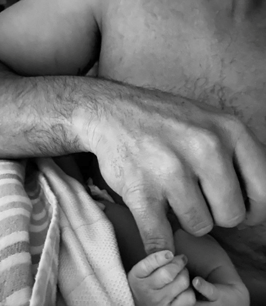 Proud new dad Cam Merchant shared a beautiful black and white snap of his son holding his little finger alongside the caption: "What an incredible experience & one that I will never forget. Mum was amazing throughout & doing well & I'm not sure I can describe the love I have & so thankful to hold your little hand throughout."