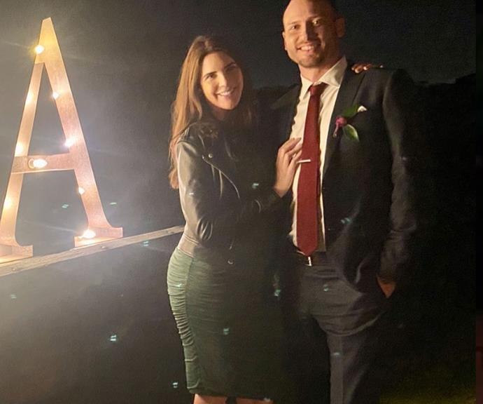 The motivational speaker's adorable bump was on full display in this figure-hugging olive-green gown when she attended a friend's wedding in October.