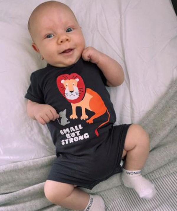 "We love watching you grow and get stronger and stronger every day little man," Loz beamed next to this adorable snap.