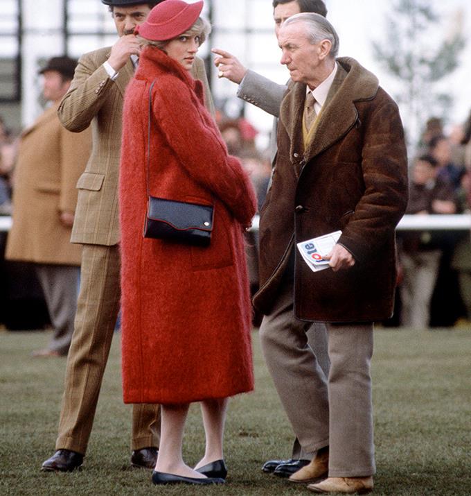 Diana's affinity for the colour red is best encapsulated by this oversized red coat styled with a red hat. For those with a knack for detail, Diana's purse features a red seam.