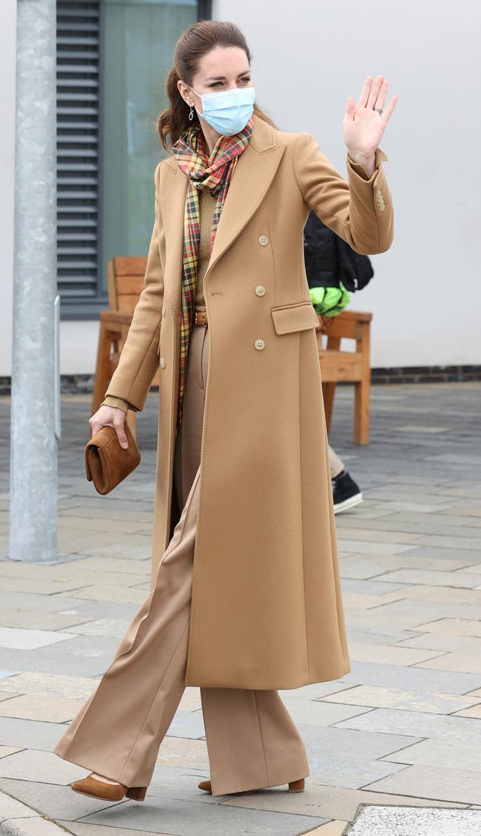 Fans were head over heels for this gorgeous morning look from Catherine, who wore [a beautiful Massimo Dutti coat](https://www.nowtolove.com.au/royals/british-royal-family/kate-middleton-camel-coat-67844|target="_blank") over some matching camel wide legged trousers. And how could we forget *that* tartan scarf! The reign continues... 