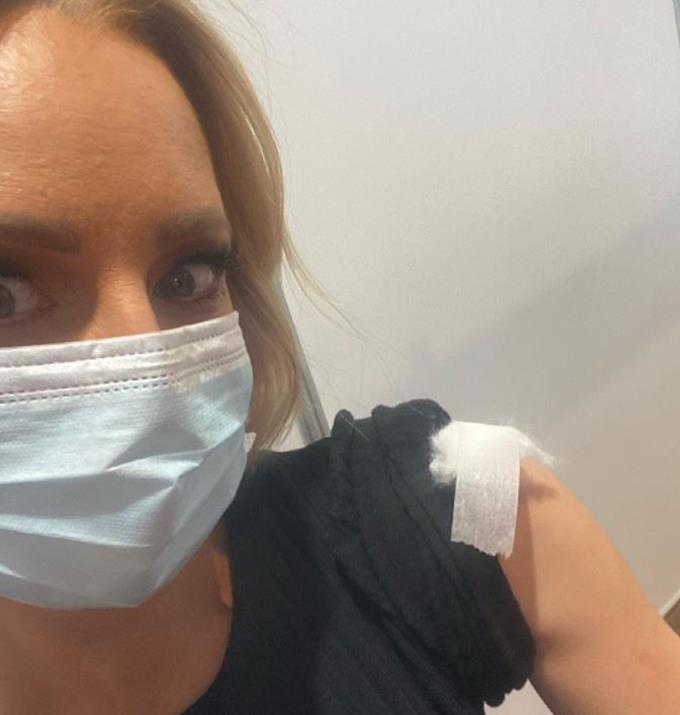 A masked up Carrie Bickmore post jab.