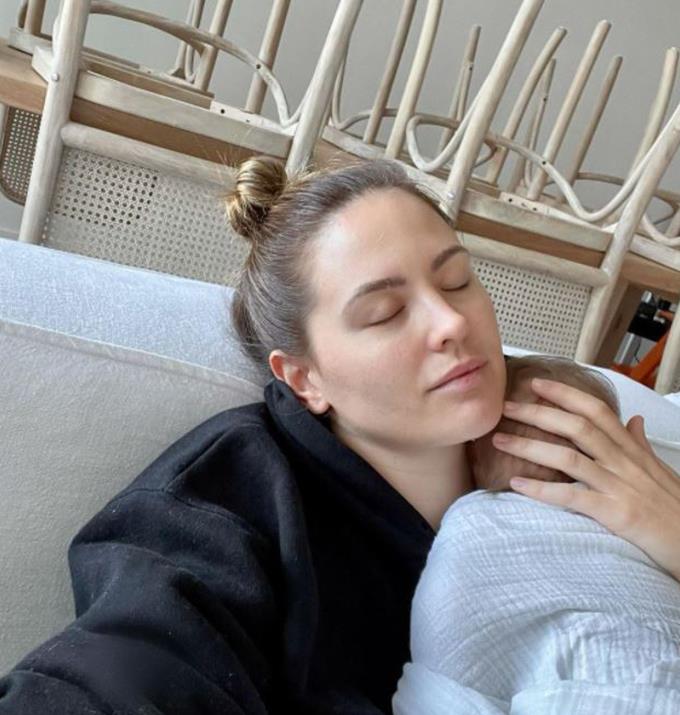 Jesinta captioned this sweet moment with her son, "I really need to mop the floors but I am enjoying these post feed cuddles too much 🥰."