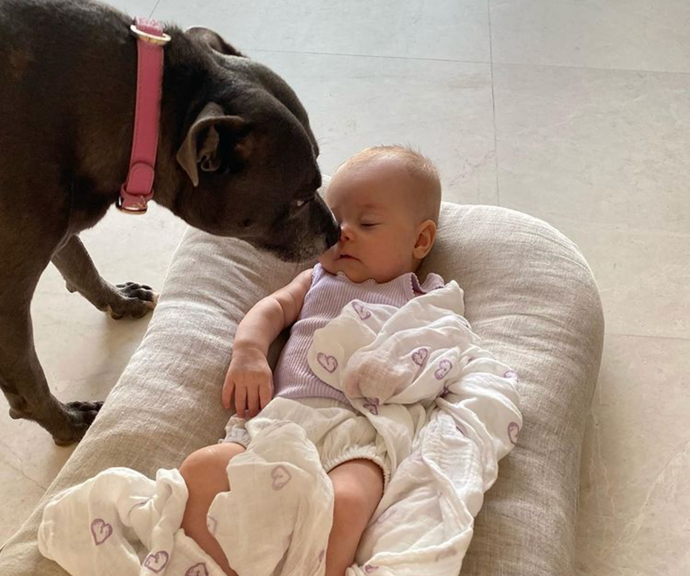 Milly kisses baby Frankie in a touching photo.