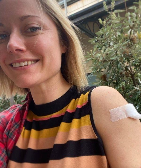 **Georgina Haig**
<br><br>
The *Back To The Rafters* star has gotten her Covid vaccine, and she wants Victorians and other Australians to get theirs too. In her post commemorating the moment, she wrote a lengthy caption about her journey. 
<br><br>
She started by sharing a link to help Victorians, and wrote, "Victorians looking for the easiest way to book Covid vaccine appointments try- portal.cvms.vic.gov.au."
<br><br>
Georgina dedicated the rest of her message to thank everyone who supported her, and she offered a helpful tip. 
<br><br>
"Thank you science and clever humans and essential workers on the ground getting this done. I feel safer, I feel safer around my dear Dad, far out, I feel humbled and overwhelmed- a tiny dot in my arm. And yet, all these tiny dots in arms will slowly bring the world back to the one we know. XXX.
<br><br>
"Importantly- #joutfit tip- sleeveless high neck top with flannel shirt for layering (I was in Frankston) provides easy access with some added warmth for winter. :)" she said.