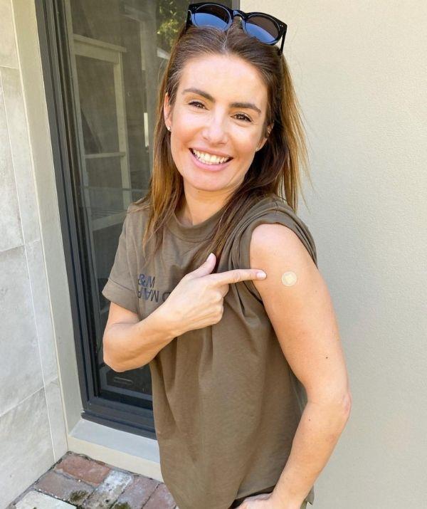 **Ada Nicodemou** 
<br><br>
The *Home and Away* star is finally fully vaccinated, and she celebrated on Instagram by posting a picture with her Band-Aid, which she captioned, "Fully vaccinated baby!! Go and get vaccinated Australia and let's get through this 👊🙌🏼."
<br><br>
Her dear friend and co-star Lynne McGranger commented, "Yay!! That's ma girl ❤️👏🙌🔥," and Georgie Parker wrote, "Good on you sweetheart."