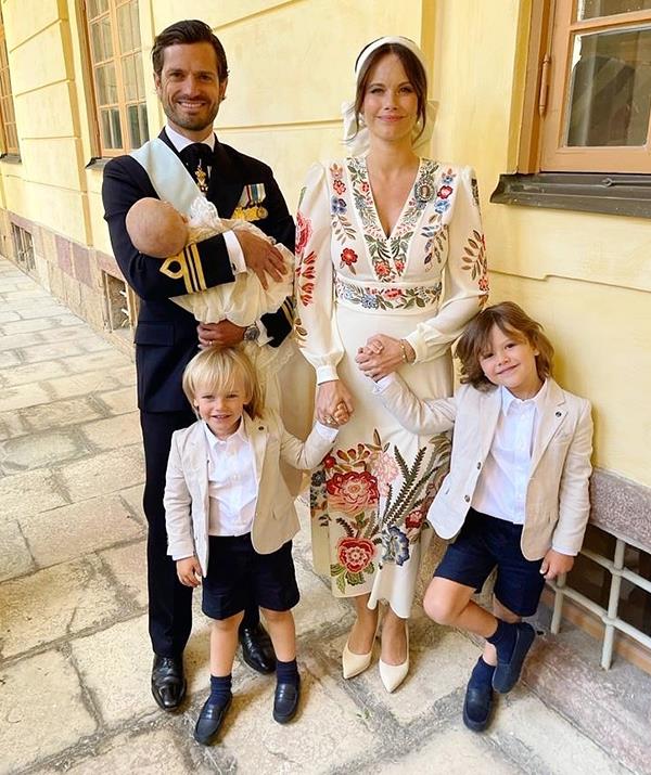 In a family candid shot, thought to have been snapped after the event, Princess Sofia beamed as she held her elder sons by the hand and Prince Carl cradled their newborn.