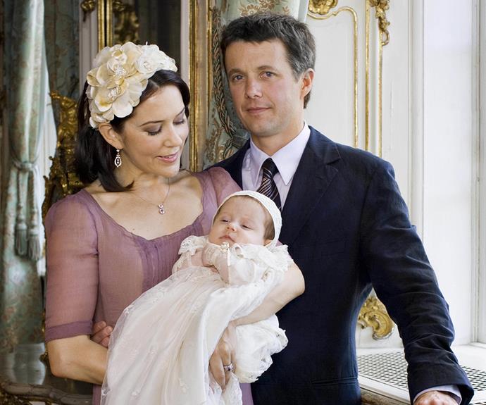Crown Princess Mary cradles Isabella as a baby on her christening day.