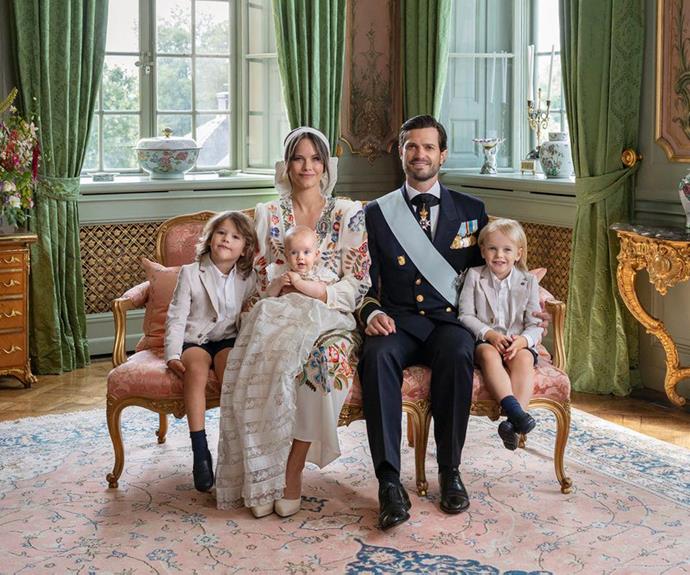 Official photographs from the special occasion show the royal family of five beaming as the celebrate young Prince Julian's baptism. The portraits were snapped at the Swedish royal family's summer home, Drottningholm Palace.