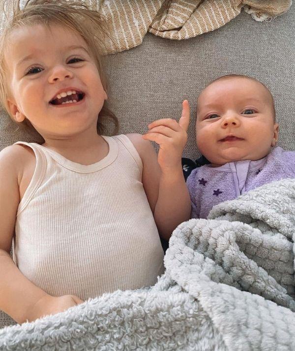 The sisters are adorable bonding together - and is that a little smile on Lola's face?