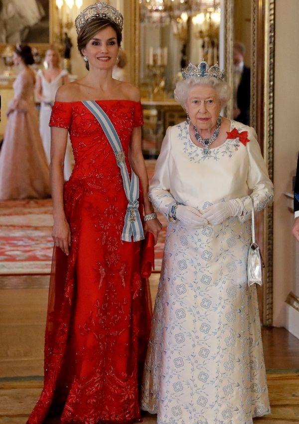 She wore this red number for a state banquet with Queen Elizabeth II in 2017. We love how her sash is tucked around her off-the-shoulder dress because it's a classy and modern take on the sometimes outdated sash.
