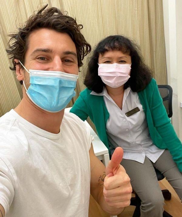 **Matty J**
<br><br>
The former *Bachelor* has gotten his first dose, and he even posed with his lovely nurse Betty to commemorate the occasion. 
<br><br>
"This is me with the lovely Betty just after she gave me the AZ jab. We're both stoked to hang out because it means she's one step closer to seeing her family," the former reality star shared. 
<br><br>
He also pointed out (much to the excitement of his fans) that the jab means he will be able to marry his fiance Laura Byrne sooner. 
<br><br>
"And I'm one step closer to finally getting hitched to @ladyandacat. See you in 6 weeks Betty!"