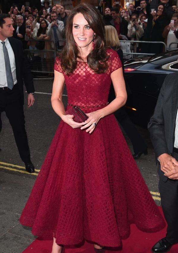 To the 2017 red carpet for *42nd Street*, Kate opted for this burgundy teacup dress by Marchesa Notte. The gown's deep colour and silhouette popped on the duchess.