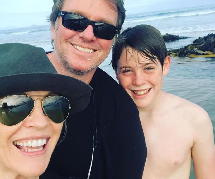 Rebecca with her husband and son, Zac at the beach.