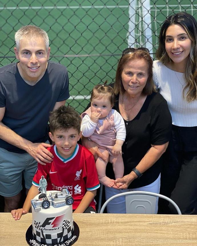 Johnas' favourite uncle Costa, his aunty Elena, and his cousin Sofia also gathered around his car racing themed cake for a family photo.