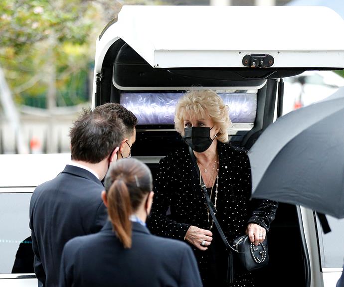 Patti chatted with fellow mourners as she arrives at St Patrick's Cathedral this morning.