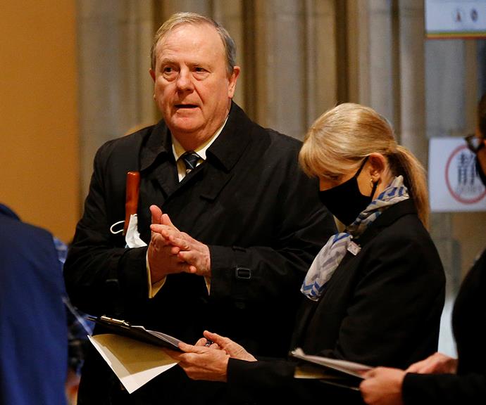 Former Australian politician Peter Costello arrived to the service looking downcast.