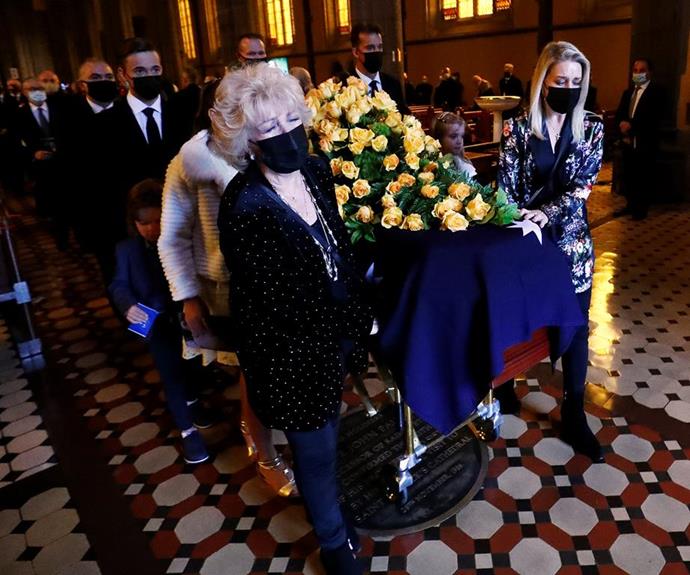 Patti wept as she exited the cathedral with Bert's coffin, her daughter and grandchildren by her side.
