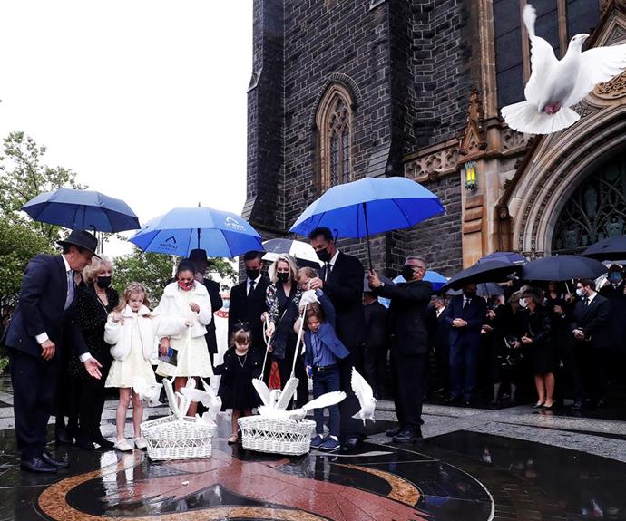 Patti and the Newton family release doves after farewelling Bert.