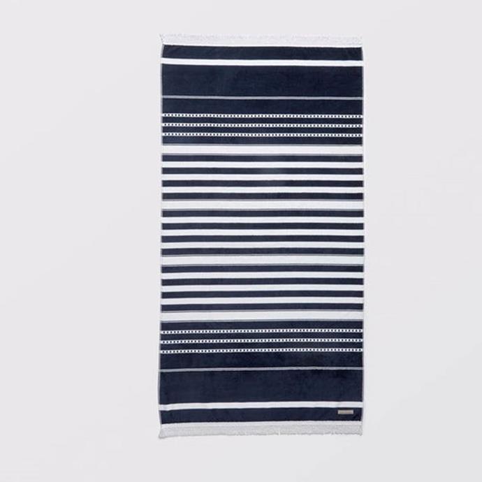 **Cotton House Ravello Beach Towel, $69.95, [Bed Bath 'N Table](https://www.bedbathntable.com.au/bath/towels/beach-towels/ravello-beach-towel-navy-white-16568001|target="_blank"|rel="nofollow")**
<br>
Classic and contemporary at the same time, if you're looking for a beach towel that will suit the whole family, you can't go past the navy and white Ravello towel.