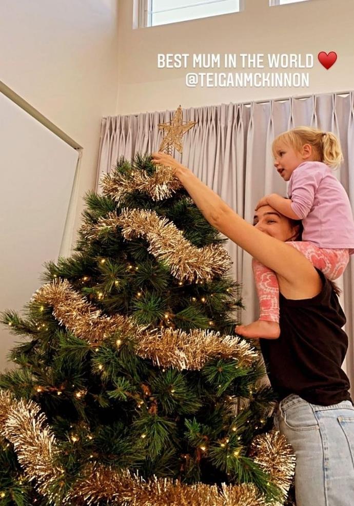 The McKinnons decorated their tree together ahead of Christmas 2021, Alex captioning this sweet snap of Teigan and Harriet, "best mum in the world."