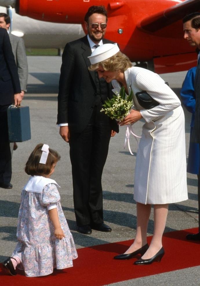This little girl may not be a royal but her moment with Diana in 1985 was too cute to resist.