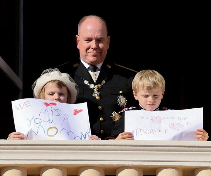 Charlene's children held up homemade signs for her on Monaco's national day.