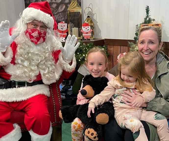 **Fifi Box**
<br><br>
The radio host kept it no secret that getting a pic with Santa and her daughters Daisy and Trixie is a complicated endeavour. Alongside this cute family picture, she detailed the reality behind her worried smile. 
<br><br>
"Santa photo done ✅🎄 This was as close as we got to a successful photo; Santa and Trixie nailing it, Daisy attempting to escape between screams, and I think my face says it all 🤪 Brilliant Santa experience at @myer 🎅🏽," she hilariously penned.