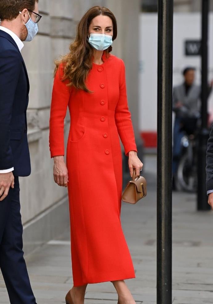 Kate made a statement for the release day of her collaborative photography book, *[Hold Still,](https://www.nowtolove.com.au/fashion/fashion-news/meghan-markle-red-dress-67671|target="_blank")* by wearing this gorgeous bright red coat. 