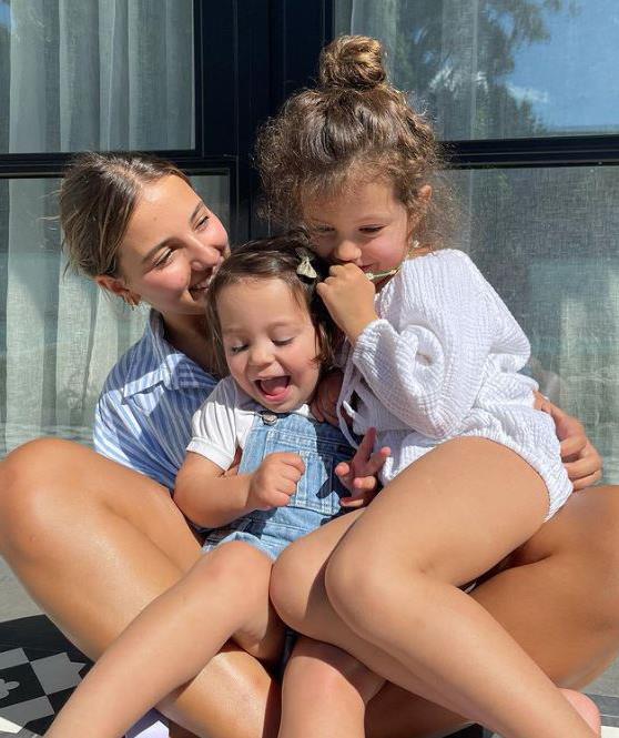 Loving sisters! Snez captioned this snap of their three girls: "Our 3 little monkeys - they're growing up so fast... Wish we could visit our family so they could spend time with the girls they are all at challenging but such beautiful ages."