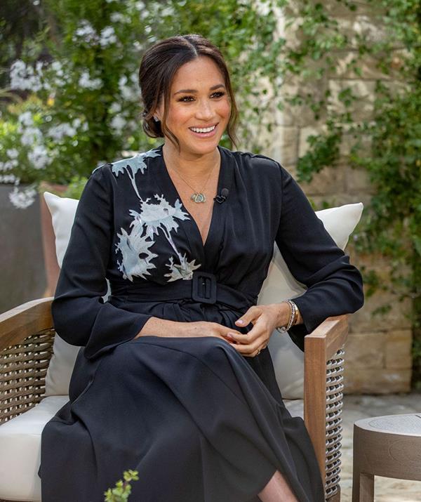 The dress the whole world saw! For Meghan and Harry's highly-publicised [Oprah tell-all](https://www.nowtolove.com.au/royals/british-royal-family/meghan-markle-prince-harry-oprah-interview-what-they-said-66994|target="_blank"), the duchess opted for this $6,500 silk Giorgio Armani dress featuring a white lotus on the right shoulder and a belted waist.