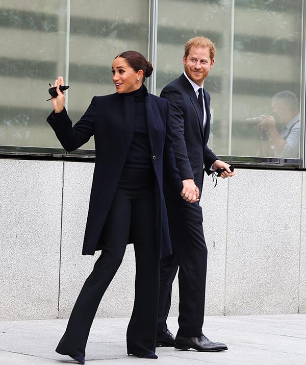 During a September visit to the One World Observatory to meet New York Governor Kathy Hochul and Mayor Bill De Blasio in New York City, Meghan proved she can look just as stunning in a more paired-back look.
<br><br>
The Duchess of Sussex opted for a navy Giorgio Armani coat, a black turtleneck and trousers with navy suede heels from one of her favourite footwear labels, Aquazzura.
<br><br>
And she didn't forget about show-stopping accessories, reusing the same diamond Cartier stud earrings from her wedding day, and a watch from luxury jewellery house Tank.
