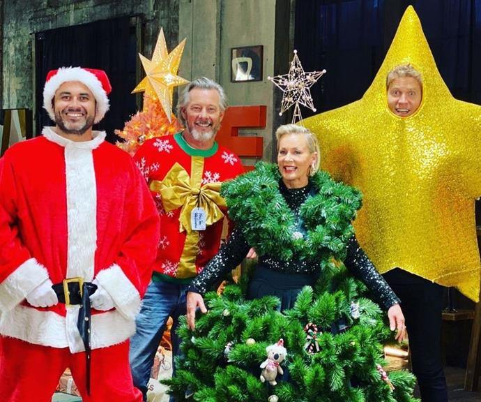**Miguel Maestre, Barry du Bois, Amanda Keller and Dr Chris Brown** 
<br><br>
The cast of the *Living Room* took a unique approach to Christmas costumes with Amanda Keller embodying a festive tree, Chris Brown as a star, Barry Du Bois dressed as a present, and of course, Miguel Maestre as Santa.