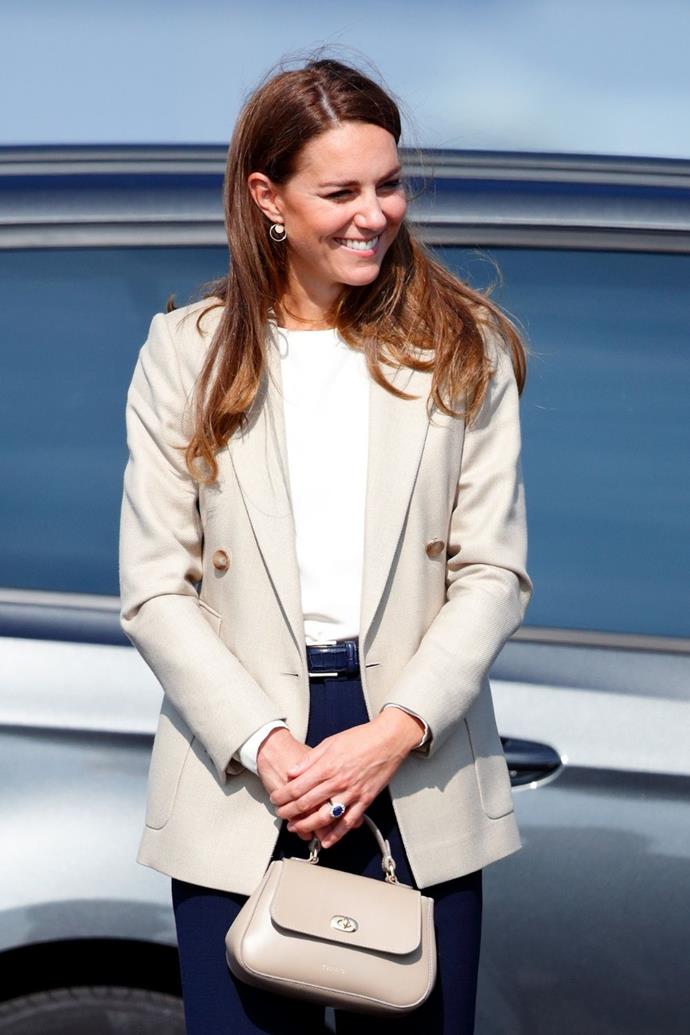 Now, turning attention to her accessories, [this beige mini handbag](https://www.nowtolove.com.au/fashion/fashion-news/kate-middleton-tusting-handbag-69101) was quite the moment.